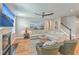 Comfortable living room featuring a fireplace, neutral sectional sofa, and stylish decor at 2150 Terrabrook Ln, Charleston, SC 29412