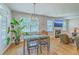 Cozy living space with hardwood flooring, fireplace, modern light fixture and outdoor access at 2150 Terrabrook Ln, Charleston, SC 29412