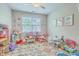 Bright and cheerful playroom with ample space for toys, games, and creative activities at 2150 Terrabrook Ln, Charleston, SC 29412