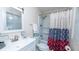 A well-lit bathroom with a shower-tub combo and modern fixtures at 2186 Spoleto Ln, North Charleston, SC 29406