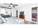 Stylish bedroom with a ceiling fan, hardwood floors and an ensuite bathroom at 2186 Spoleto Ln, North Charleston, SC 29406