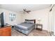 Comfortable bedroom featuring a queen bed, ceiling fan, and natural light, offering a serene and relaxing space at 2186 Spoleto Ln, North Charleston, SC 29406