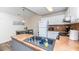 Efficient kitchen with white cabinets, modern sink, and dining table creating a functional and stylish cooking space at 2186 Spoleto Ln, North Charleston, SC 29406