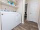 Laundry room with new washer and dryer and open shelving at 2186 Spoleto Ln, North Charleston, SC 29406