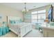 This bedroom boasts a ceiling fan, chandelier and a bed with matching side tables at 269 Village Stone Cir, Summerville, SC 29483