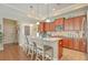 Kitchen with stainless appliances, granite counters, wood cabinets, an island and seating, and a walk-in pantry at 269 Village Stone Cir, Summerville, SC 29483