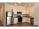 Modern kitchen with stainless steel appliances and white cabinetry with granite countertops at 2703 Scarlett Maple St, Summerville, SC 29486