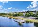 Aerial view of a waterfront community featuring a dock and beautiful blue skies at 2961 Sweetleaf Ln, Johns Island, SC 29455