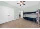 This bedroom features neutral carpet, pale green walls, and a full bunk bed set at 2961 Sweetleaf Ln, Johns Island, SC 29455