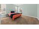 Cozy bedroom provides ample natural light, neutral decor, and en-suite bathroom access at 2961 Sweetleaf Ln, Johns Island, SC 29455
