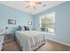 Bright bedroom with a ceiling fan, comfy bed, neutral carpet, and a large window at 2961 Sweetleaf Ln, Johns Island, SC 29455