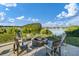 The outdoor community area features chairs and a firepit in a lakeside setting at 2961 Sweetleaf Ln, Johns Island, SC 29455