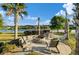 A relaxing community area with a stone fire pit and lakeside views at 2961 Sweetleaf Ln, Johns Island, SC 29455