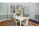Cozy dining room with a modern light fixture and colorful rug at 2961 Sweetleaf Ln, Johns Island, SC 29455