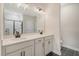 Modern bathroom featuring a double sink vanity with sleek black fixtures, and a glass-enclosed shower at 299 Lucca Dr, Summerville, SC 29486