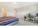 This bedroom is spacious and features a desk with a computer and a comfortable bed, perfect for relaxation and productivity at 299 Lucca Dr, Summerville, SC 29486