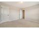 Bedroom featuring neutral carpet and paint, with two closets and an open doorway, offering versatility at 299 Lucca Dr, Summerville, SC 29486