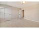 Bedroom featuring neutral carpet and paint, with a large closet and open doorway leading to another room at 299 Lucca Dr, Summerville, SC 29486