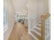 Inviting entryway with wood-look flooring and stairs leading to an open living space with lots of natural light at 299 Lucca Dr, Summerville, SC 29486