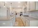 Large kitchen with stainless steel appliances, a center island and gray backsplash at 299 Lucca Dr, Summerville, SC 29486