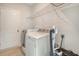 Convenient laundry room with a washing machine, dryer, wire shelving, and ample space for laundry tasks at 299 Lucca Dr, Summerville, SC 29486