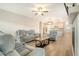 Open concept living room seamlessly connects to a modern kitchen, perfect for entertaining and Gathering gatherings at 299 Lucca Dr, Summerville, SC 29486