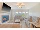 Comfortable living room with fireplace, TV, and lots of natural light, perfect for relaxing and watching movies at 299 Lucca Dr, Summerville, SC 29486