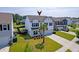 Aerial view of a beautifully landscaped two-story home and well manicured lawn at 3018 Vincent Astor Dr, Johns Island, SC 29455