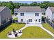 Aerial view of a home's fenced backyard, patio, and firepit gathering area at 3018 Vincent Astor Dr, Johns Island, SC 29455