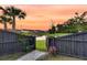 Serene backyard offering a gate with access to a tranquil pond and community views at 3018 Vincent Astor Dr, Johns Island, SC 29455