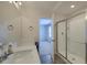 Bright bathroom with a modern vanity, shower and view to the bedroom at 3018 Vincent Astor Dr, Johns Island, SC 29455