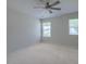 A bright bedroom offers neutral carpet and two windows for lots of natural light at 3018 Vincent Astor Dr, Johns Island, SC 29455