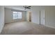 Bright bedroom features plush carpet, a ceiling fan, and a window for natural light at 3018 Vincent Astor Dr, Johns Island, SC 29455