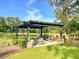 An outdoor pergola with seating area provides a tranquil community space for relaxing and socializing at 3018 Vincent Astor Dr, Johns Island, SC 29455