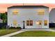 The backyard has white siding, a patio and a well-maintained lawn area at 3018 Vincent Astor Dr, Johns Island, SC 29455