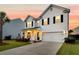 Charming two-story home featuring a well-manicured lawn and inviting curb appeal at 3018 Vincent Astor Dr, Johns Island, SC 29455