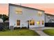 The backyard features white siding, a patio, and a meticulously maintained lawn at 3018 Vincent Astor Dr, Johns Island, SC 29455