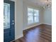 Inviting Foyer with a decorative front door, hardwood floors, and modern light fixture at 3018 Vincent Astor Dr, Johns Island, SC 29455