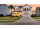 Charming two-story home with a well manicured yard, a palm tree and two car garage at 3018 Vincent Astor Dr, Johns Island, SC 29455