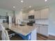 Modern kitchen with stainless steel appliances, granite countertops, and a large island at 3018 Vincent Astor Dr, Johns Island, SC 29455