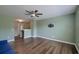 Open living room with wood floors and a ceiling fan, creating a comfortable and inviting space at 3018 Vincent Astor Dr, Johns Island, SC 29455