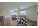 Spacious living room with hardwood flooring, ceiling fan, and view to the kitchen and front door at 3018 Vincent Astor Dr, Johns Island, SC 29455
