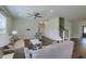 Comfortable living room with ceiling fan, hardwood flooring, and shiplap wall, creating a cozy atmosphere at 3018 Vincent Astor Dr, Johns Island, SC 29455