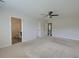 Large main bedroom featuring neutral carpet, a ceiling fan, and access to an ensuite bathroom at 3018 Vincent Astor Dr, Johns Island, SC 29455