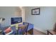 This office includes a stylish blue desk and chair with modern computer and accessories at 3018 Vincent Astor Dr, Johns Island, SC 29455