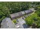 Aerial view of brick townhomes featuring mature trees, parking areas, and attractive landscaping at 302 Springview Ln # 7, Summerville, SC 29485