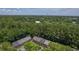 High aerial view of townhomes surrounded by lush trees, showcasing a community at 302 Springview Ln # 7, Summerville, SC 29485