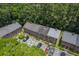 Aerial view capturing well-maintained brick townhomes amid green landscaping and convenient parking at 302 Springview Ln # 7, Summerville, SC 29485