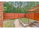 Fenced backyard with a concrete patio and lush, surrounding greenery offering a private outdoor space at 302 Springview Ln # 7, Summerville, SC 29485
