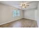 Sunlit bedroom with wood-look flooring and neutral paint, ready for personalized décor at 302 Springview Ln # 7, Summerville, SC 29485